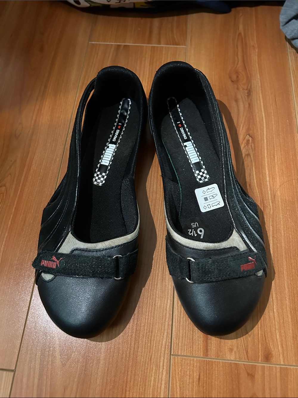 Puma Women’s Black Slip-On Ballet Flats with Red Logo Accent